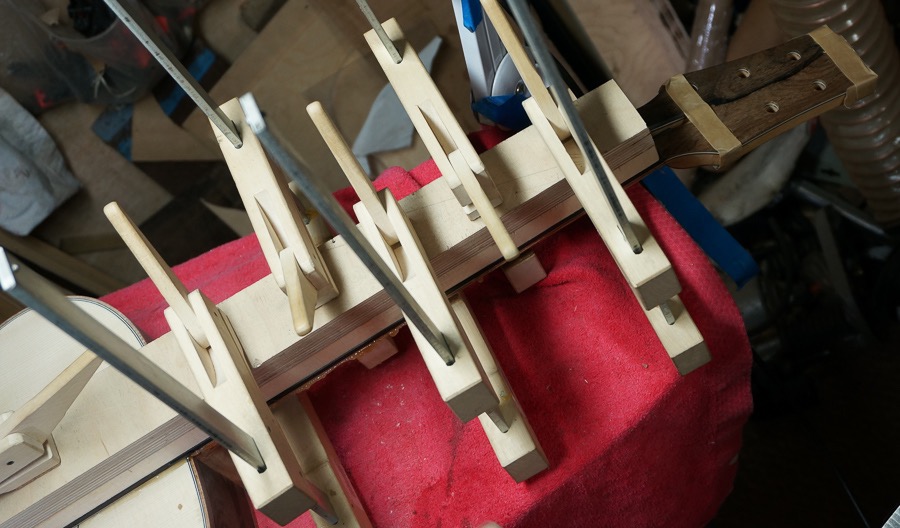 Super flat clamping caul makes sure fingerboard squeezes out all excess glue.jpg